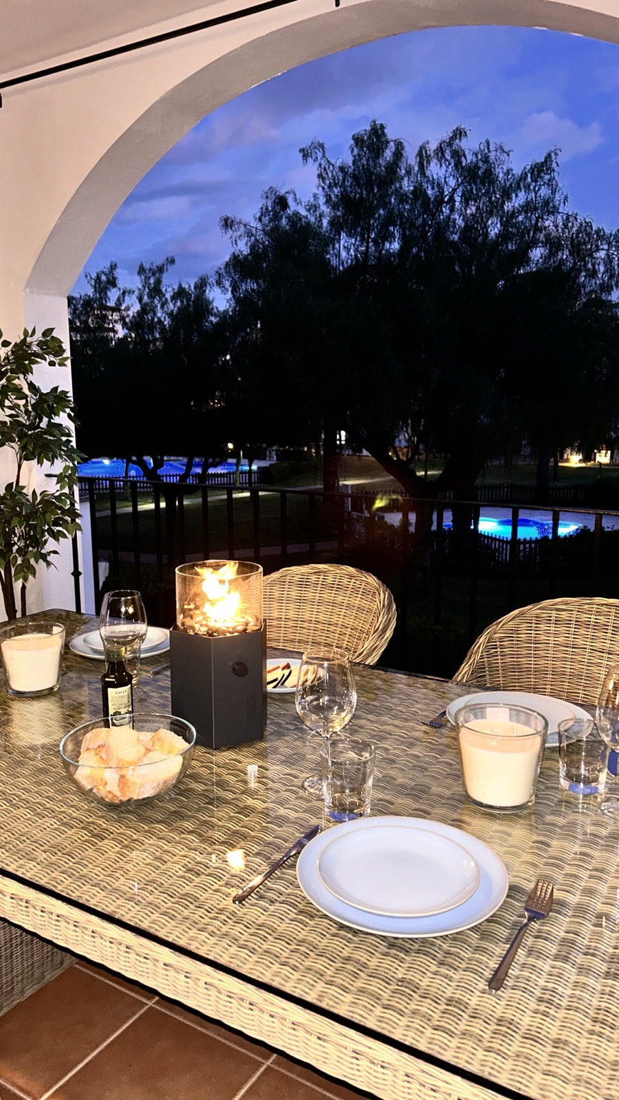 Terrace at dusk overlooking the resort gardens